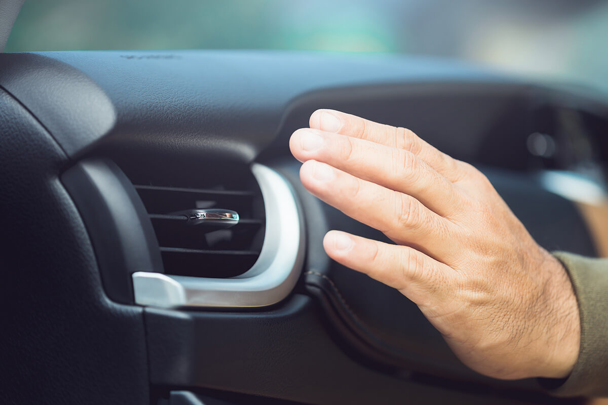 Car owner checks the air conditioning system