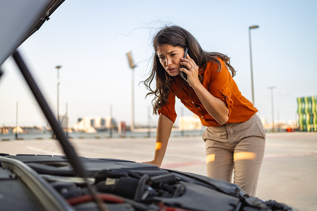 woman calling a car assistance service